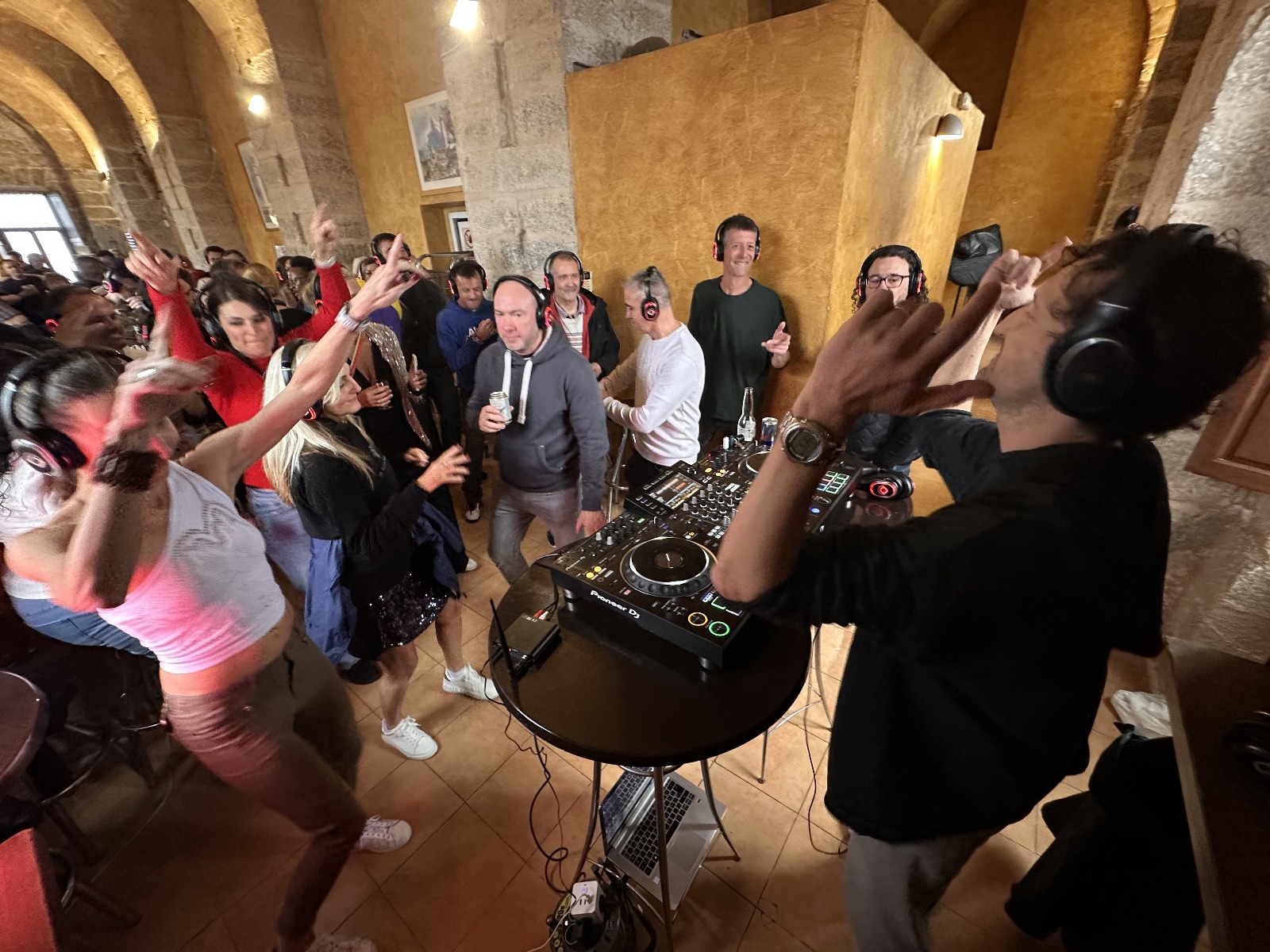 Crowd dancing at a Balearic Beats silent disco event in Mallorca